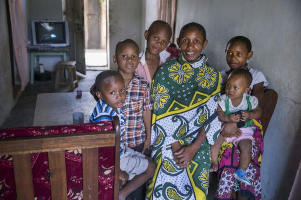 An extended family gathered together in their home in Kenya